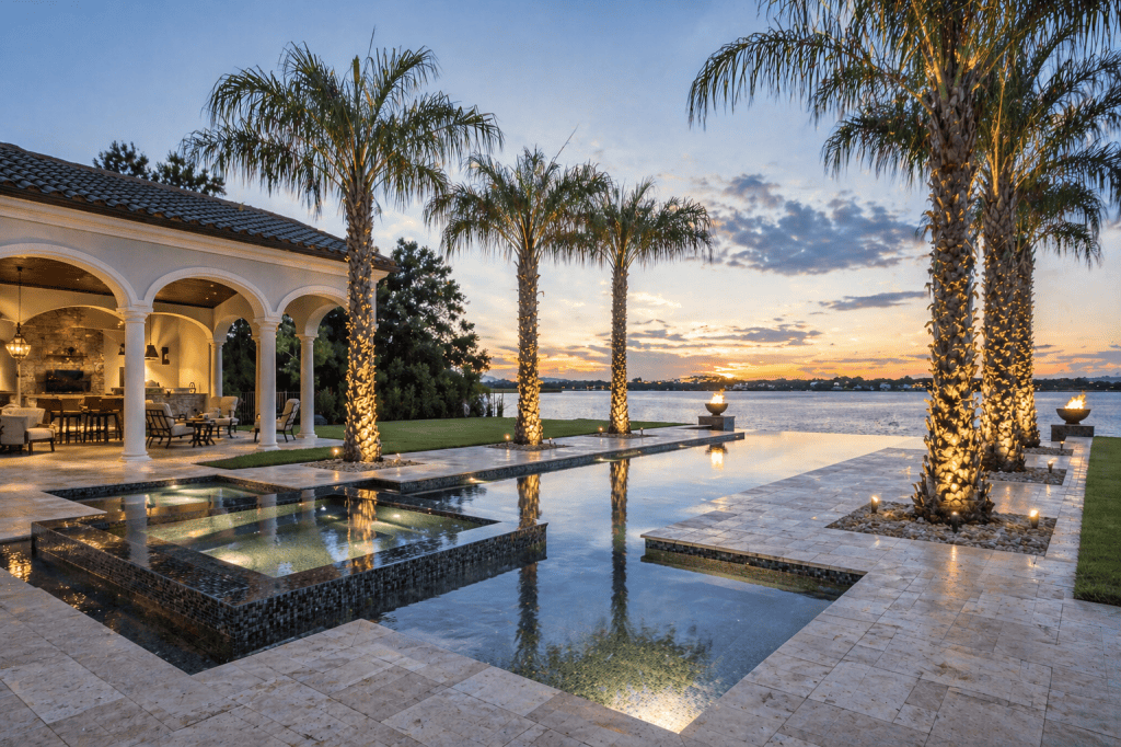 Luxury waterfront home with pool and palm trees in South Florida